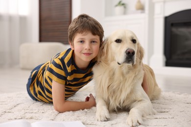 Boy with his cute dog at home