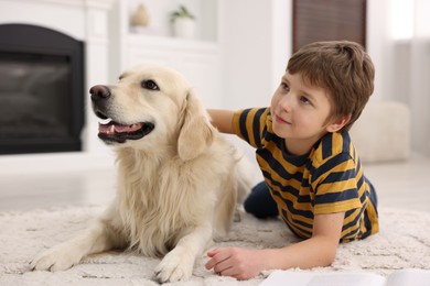 Photo of Boy with his cute dog at home