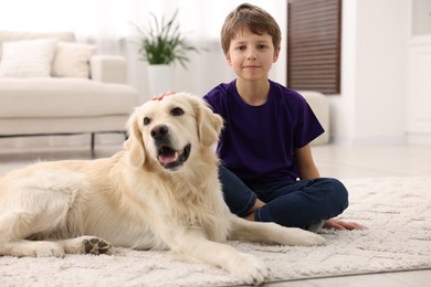 Photo of Boy with his cute dog at home