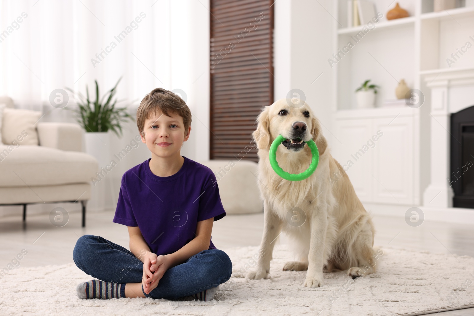 Photo of Boy with his cute dog at home