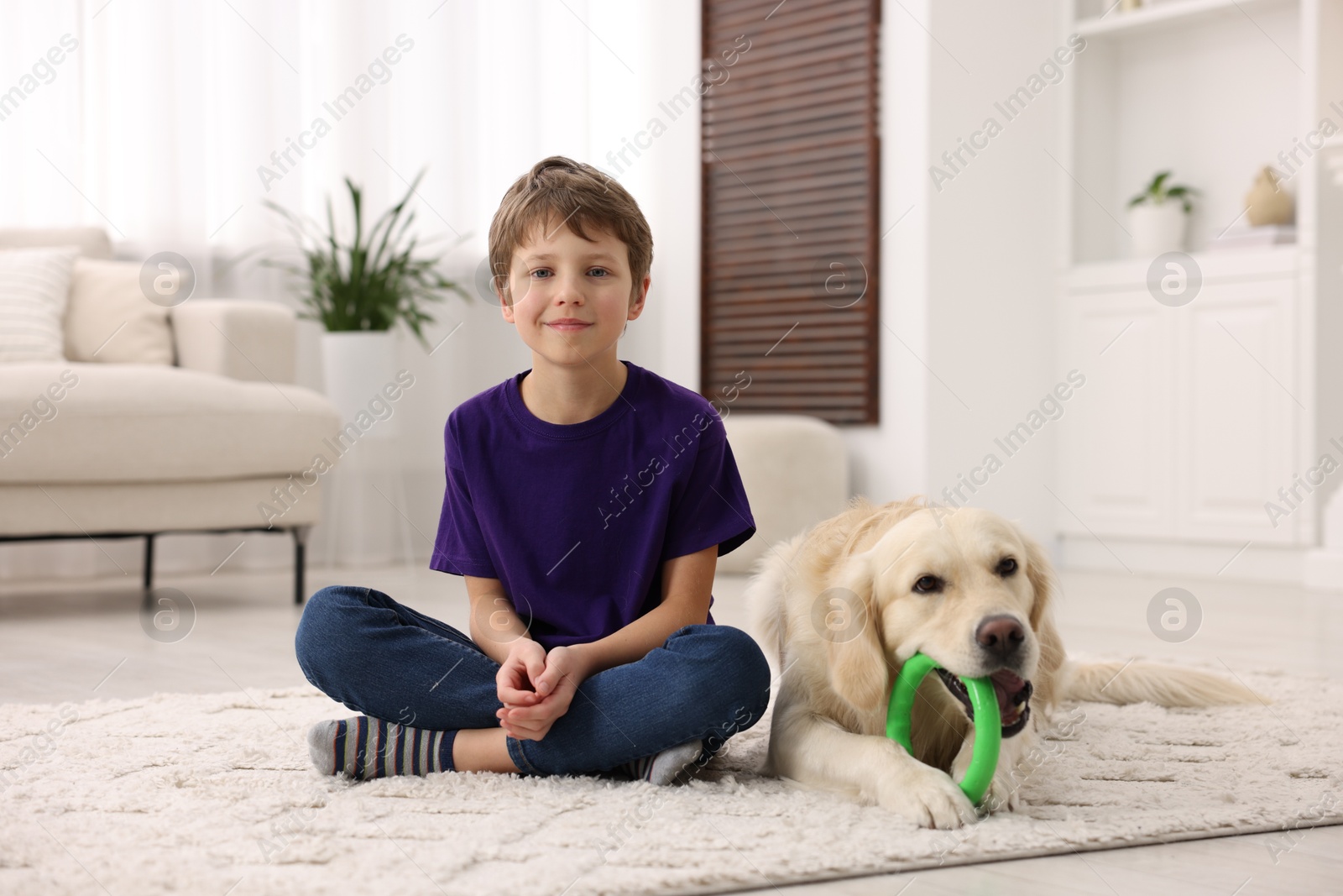 Photo of Boy with his cute dog at home