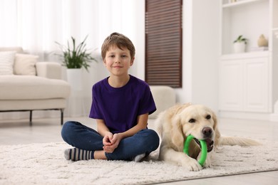 Boy with his cute dog at home