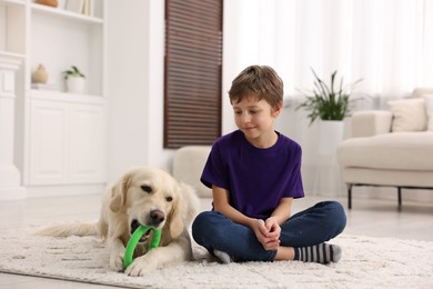 Boy with his cute dog at home