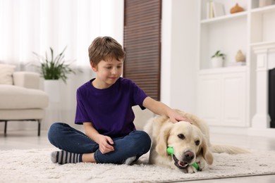 Boy with his cute dog at home