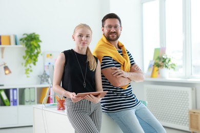 Designers with tablet working together in office