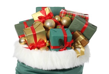 Photo of Santa Claus bag with gift boxes and Christmas balls isolated on white