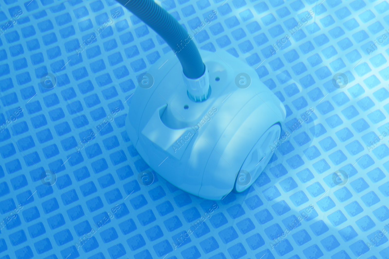 Photo of One robotic cleaner in swimming pool outdoors