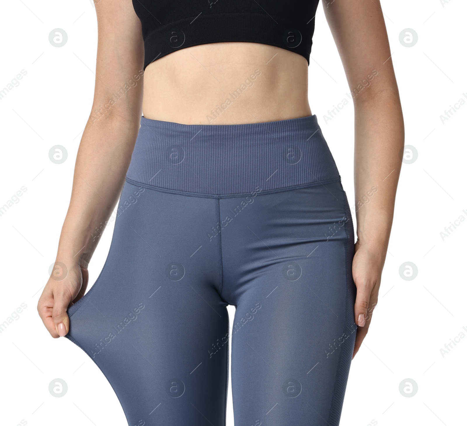 Photo of Woman wearing sports leggings on white background, closeup