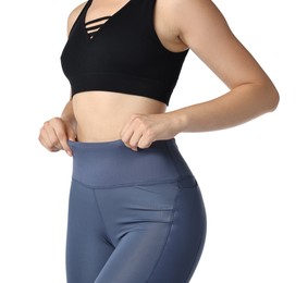 Photo of Woman wearing sports leggings and bra on white background, closeup