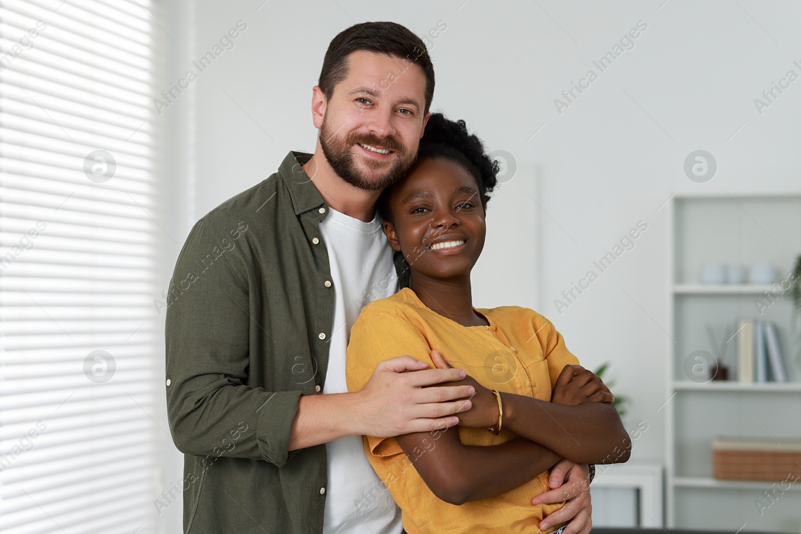 Photo of International relationships. Portrait of lovely couple at home