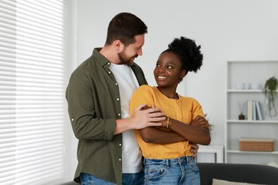 International relationships. Portrait of lovely couple at home