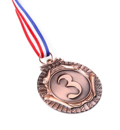 Photo of One bronze medal with ribbon isolated on white