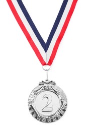 Photo of Silver medal with striped ribbon isolated on white, top view