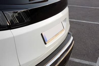 Closeup view of modern white car parked outdoors