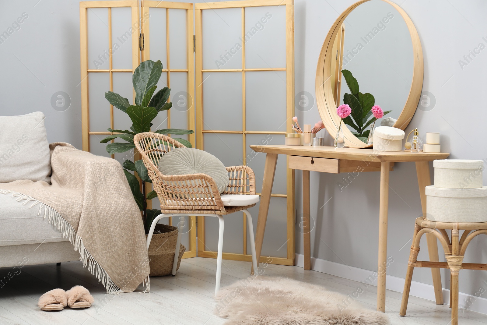 Photo of Mirror, dressing table, houseplant, folding screen and chair indoors. Interior design