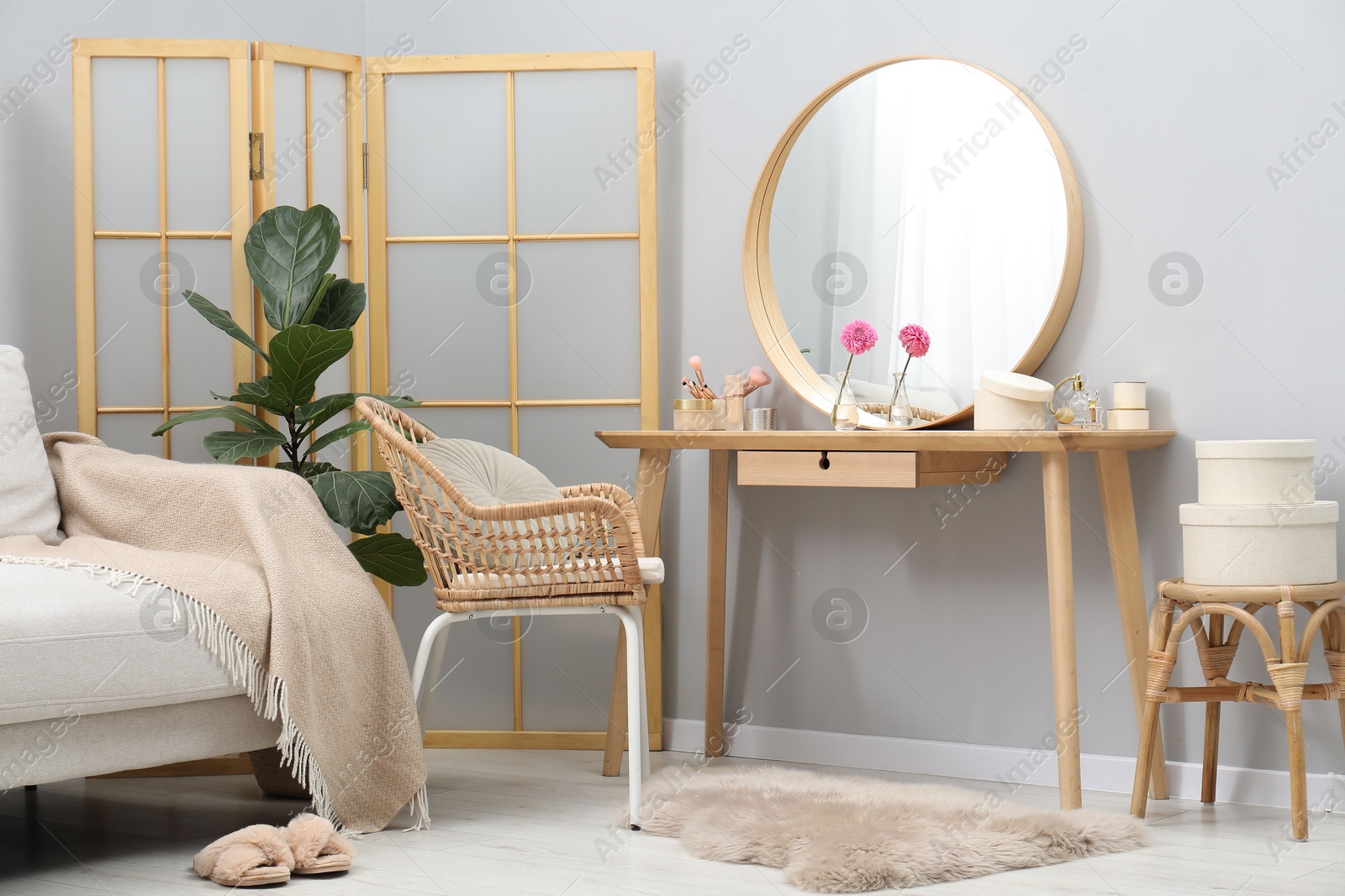 Photo of Mirror, dressing table, houseplant, folding screen and chair indoors. Interior design