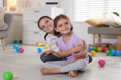 Photo of Portrait of cute little sisters at home