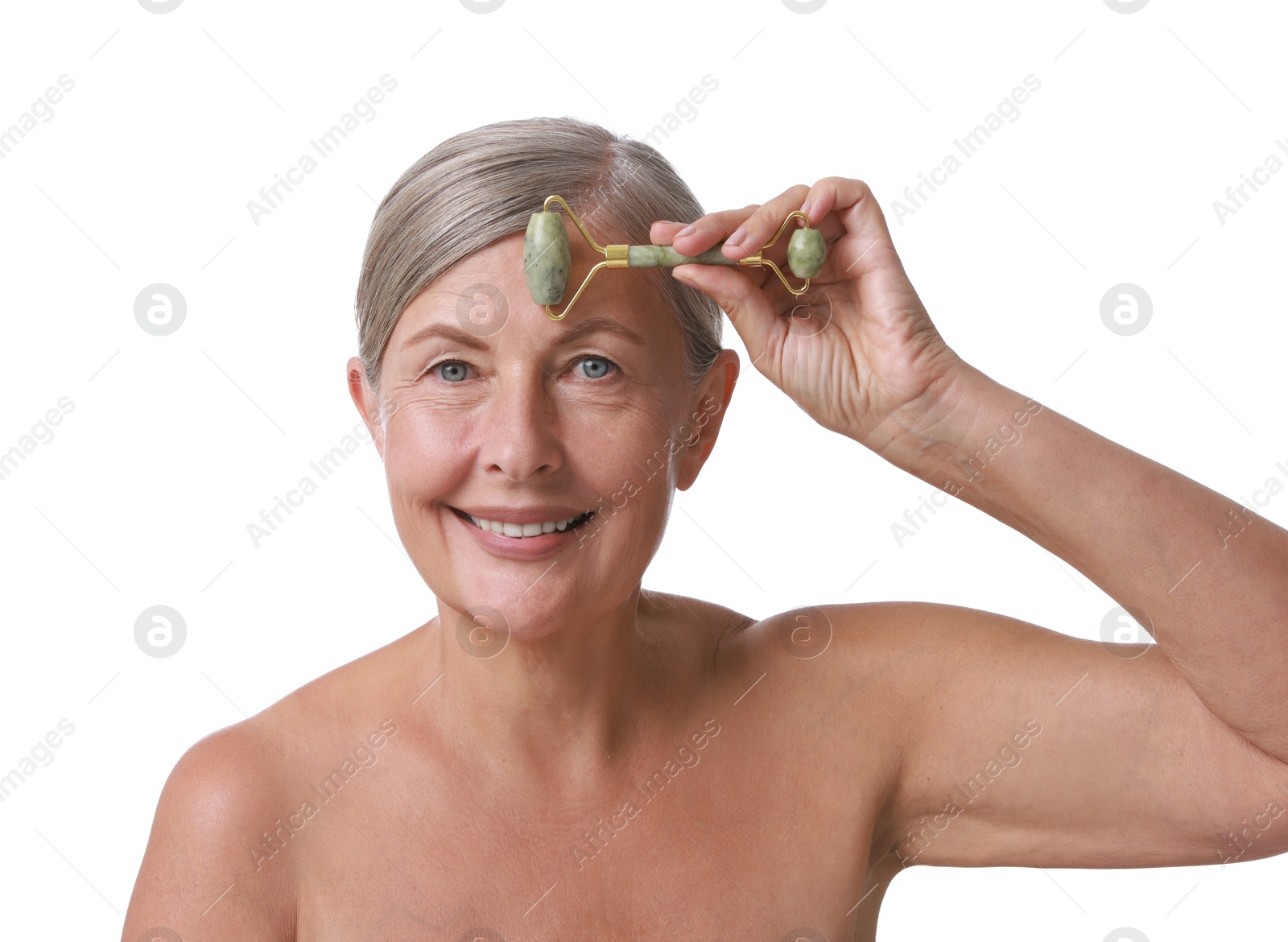 Photo of Beautiful woman doing facial massage with roller on white background