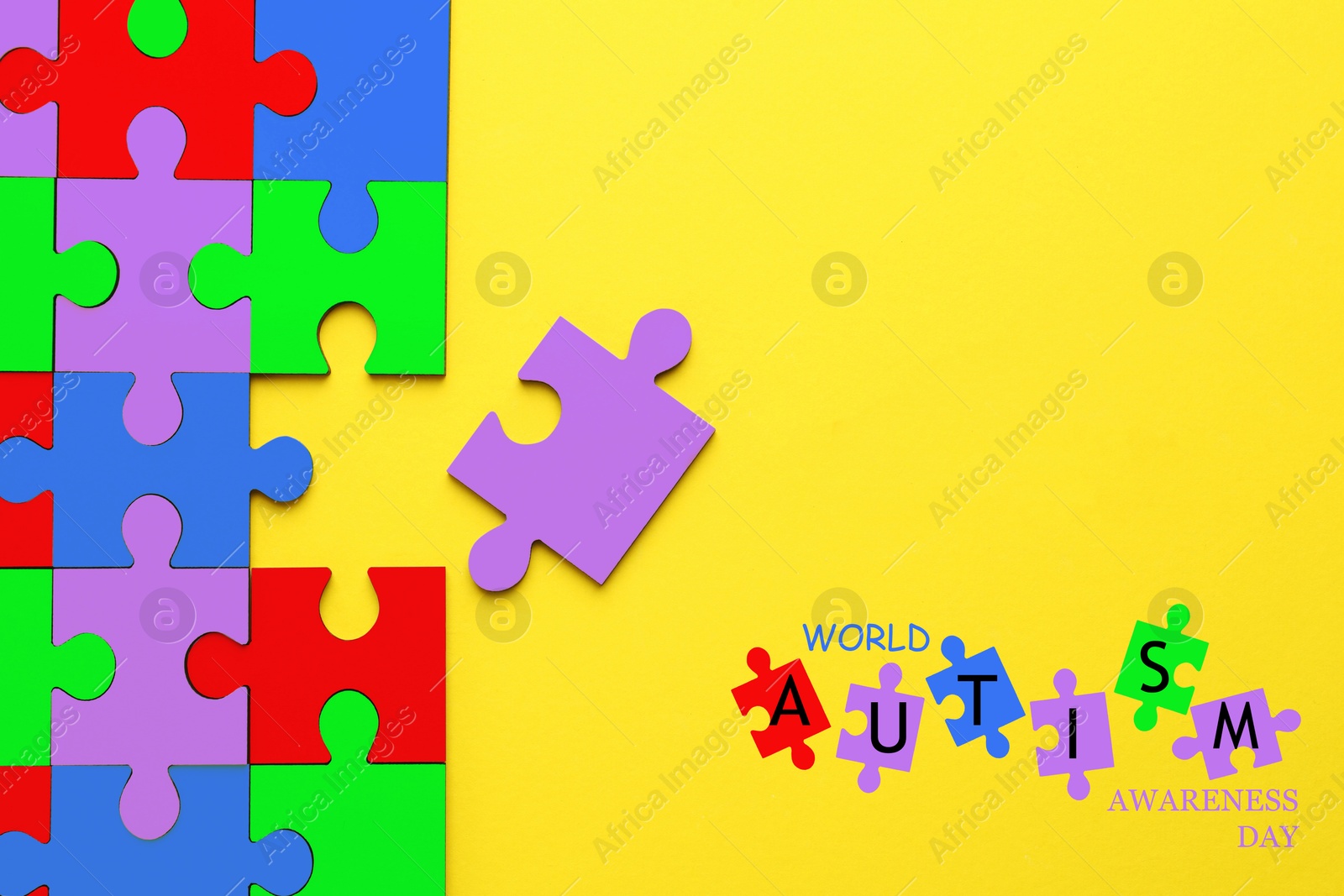 Image of World Autism Awareness Day text and colorful puzzle pieces on yellow background, top view