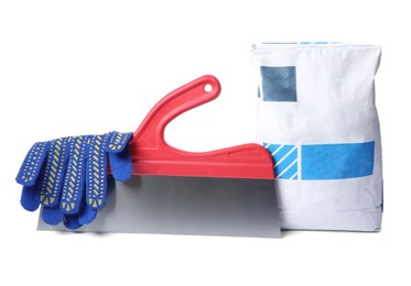 Photo of Bag of cement, gloves and plastering trowel on white background