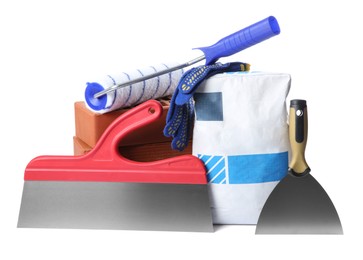 Construction tools and building materials on white background