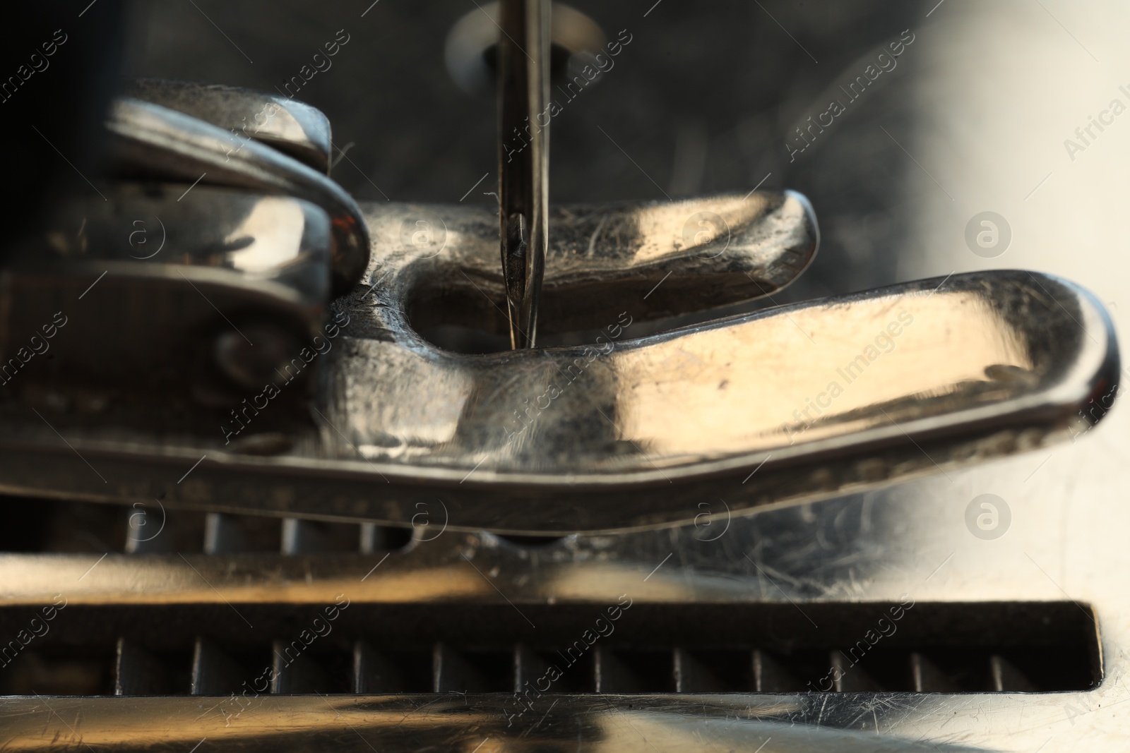 Photo of Macro view of one metal sewing machine