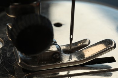 Photo of Macro view of one metal sewing machine