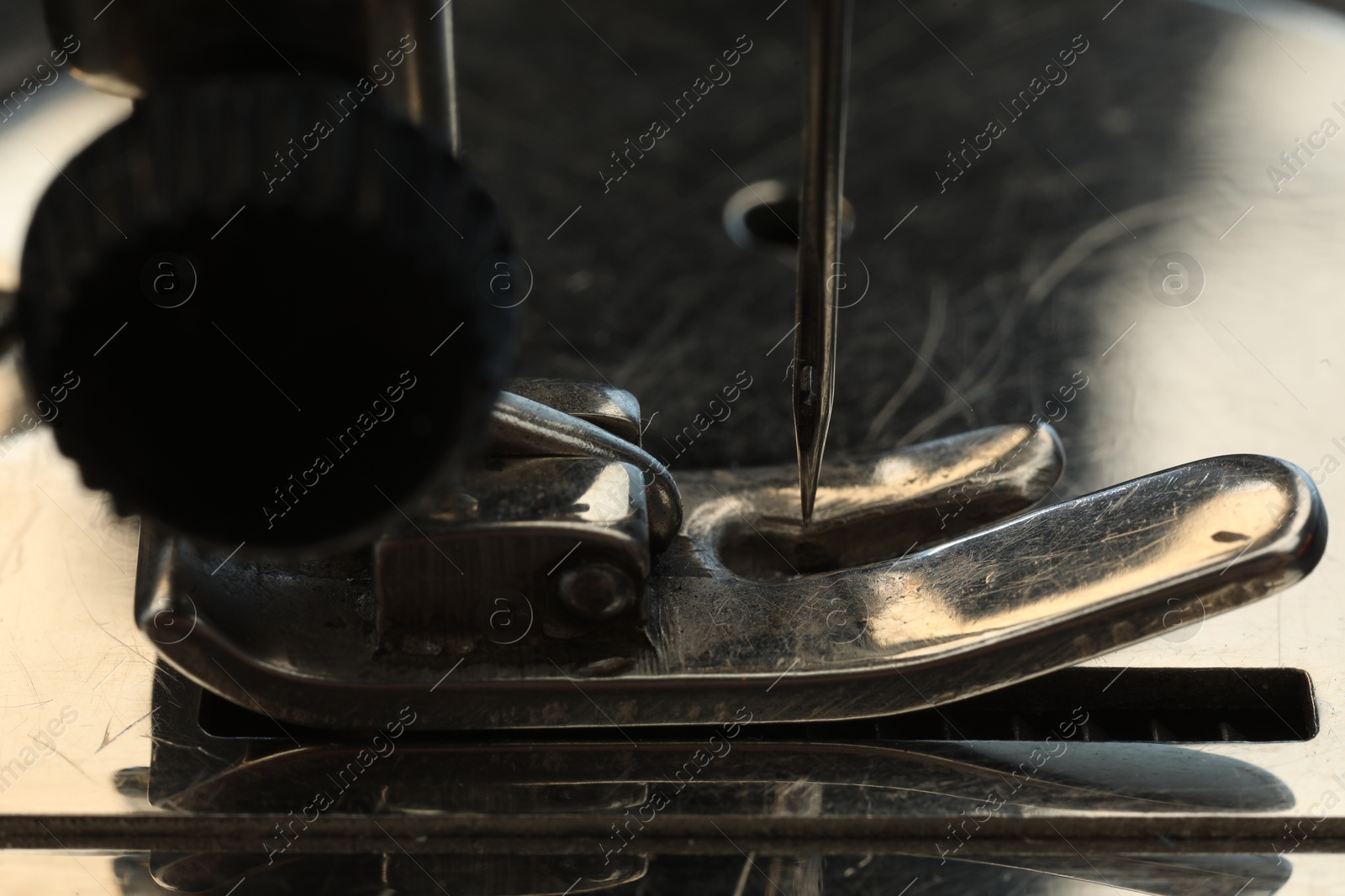 Photo of Macro view of one metal sewing machine