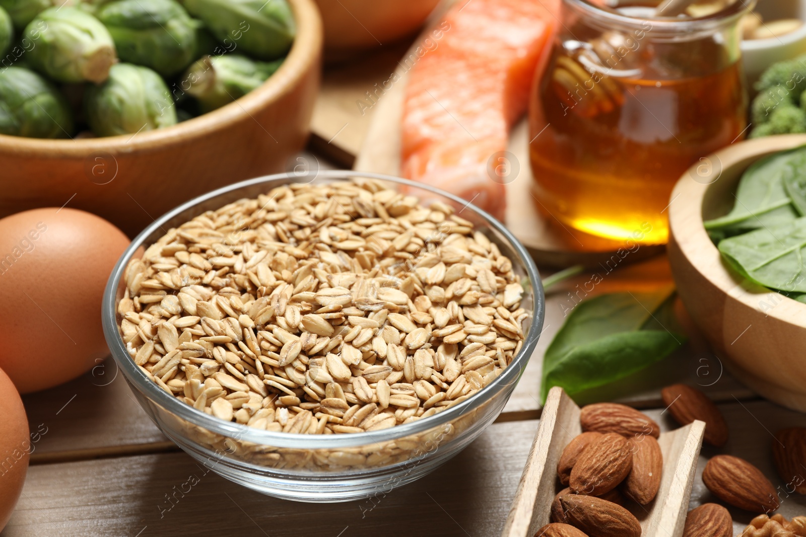 Photo of Different products rich in melatonin on wooden table, closeup