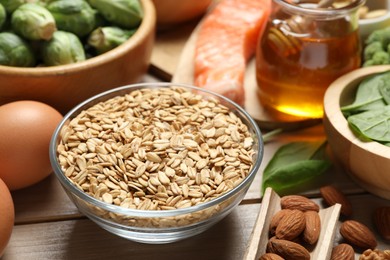 Photo of Different products rich in melatonin on wooden table, closeup