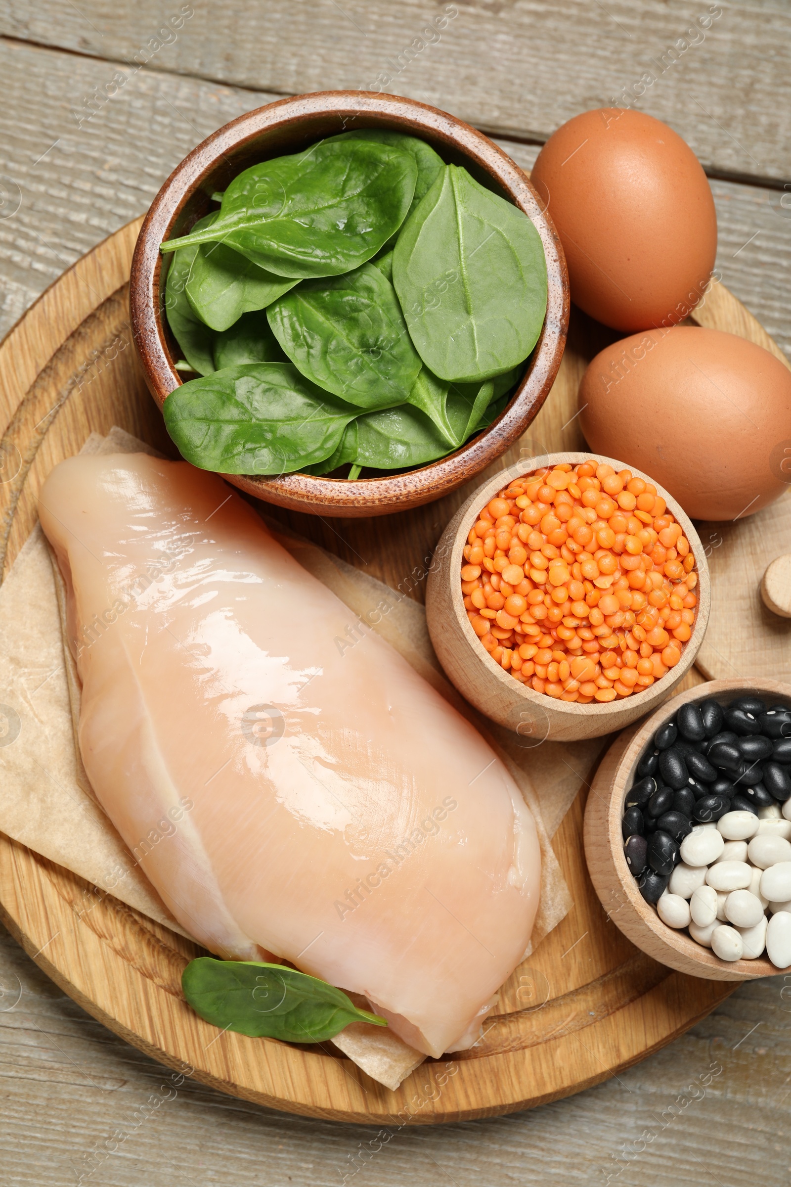 Photo of Different products rich in estrogen on wooden table, top view