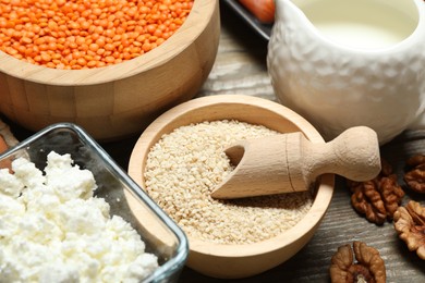 Photo of Different products rich in estrogen on wooden table, closeup