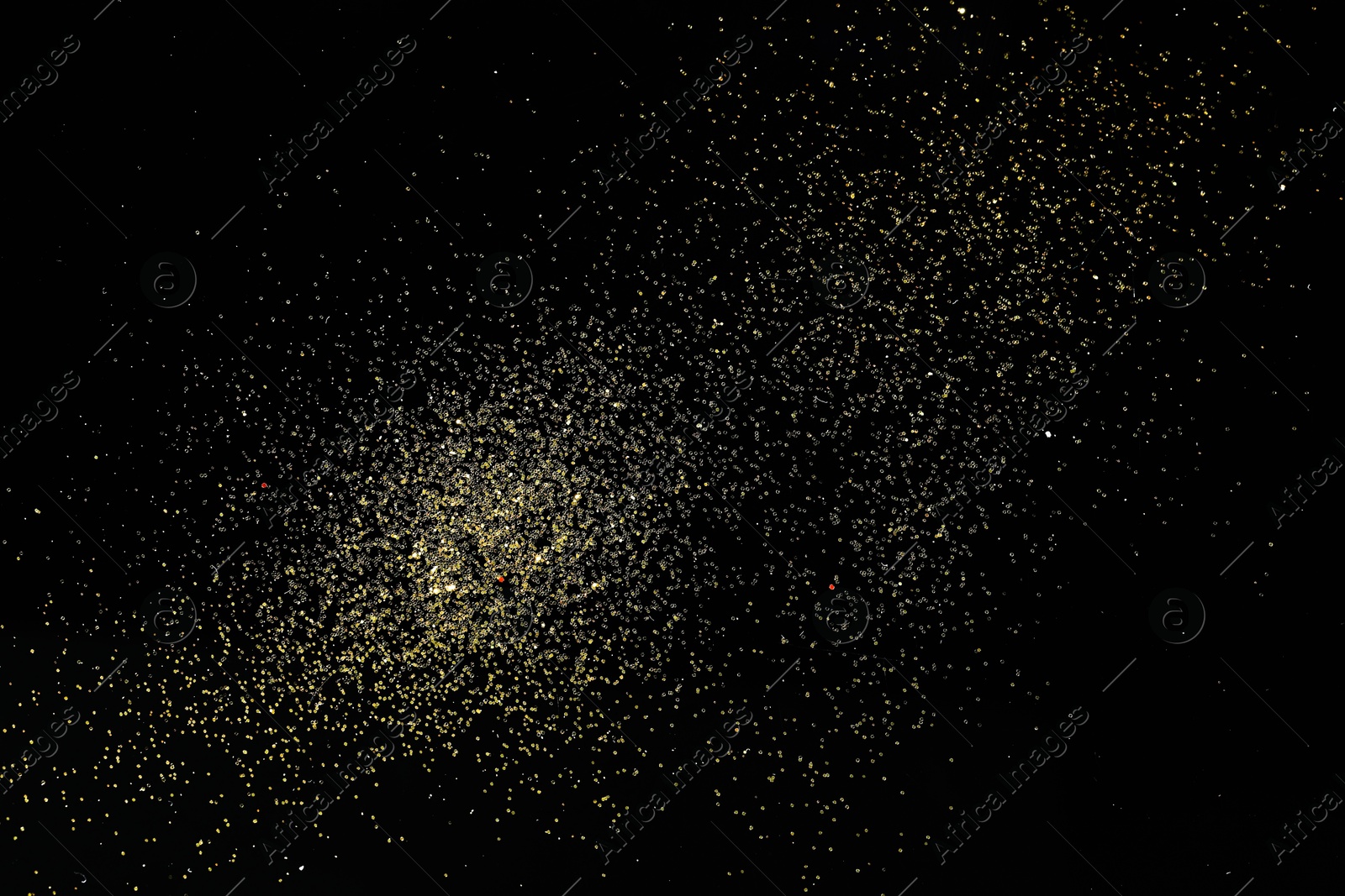 Photo of Beautiful shiny golden glitter on black background, top view