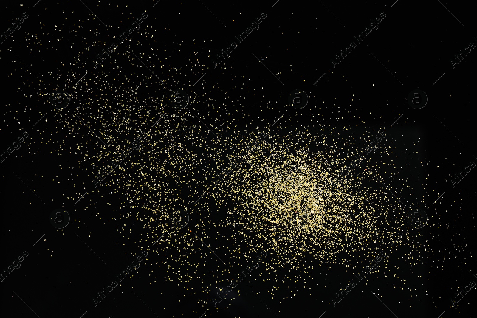 Photo of Beautiful shiny golden glitter on black background, top view