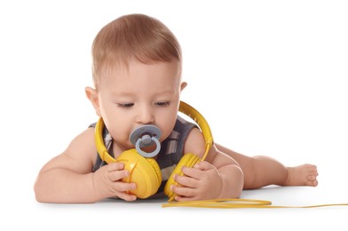 Photo of Cute little baby with pacifier and headphones on white background