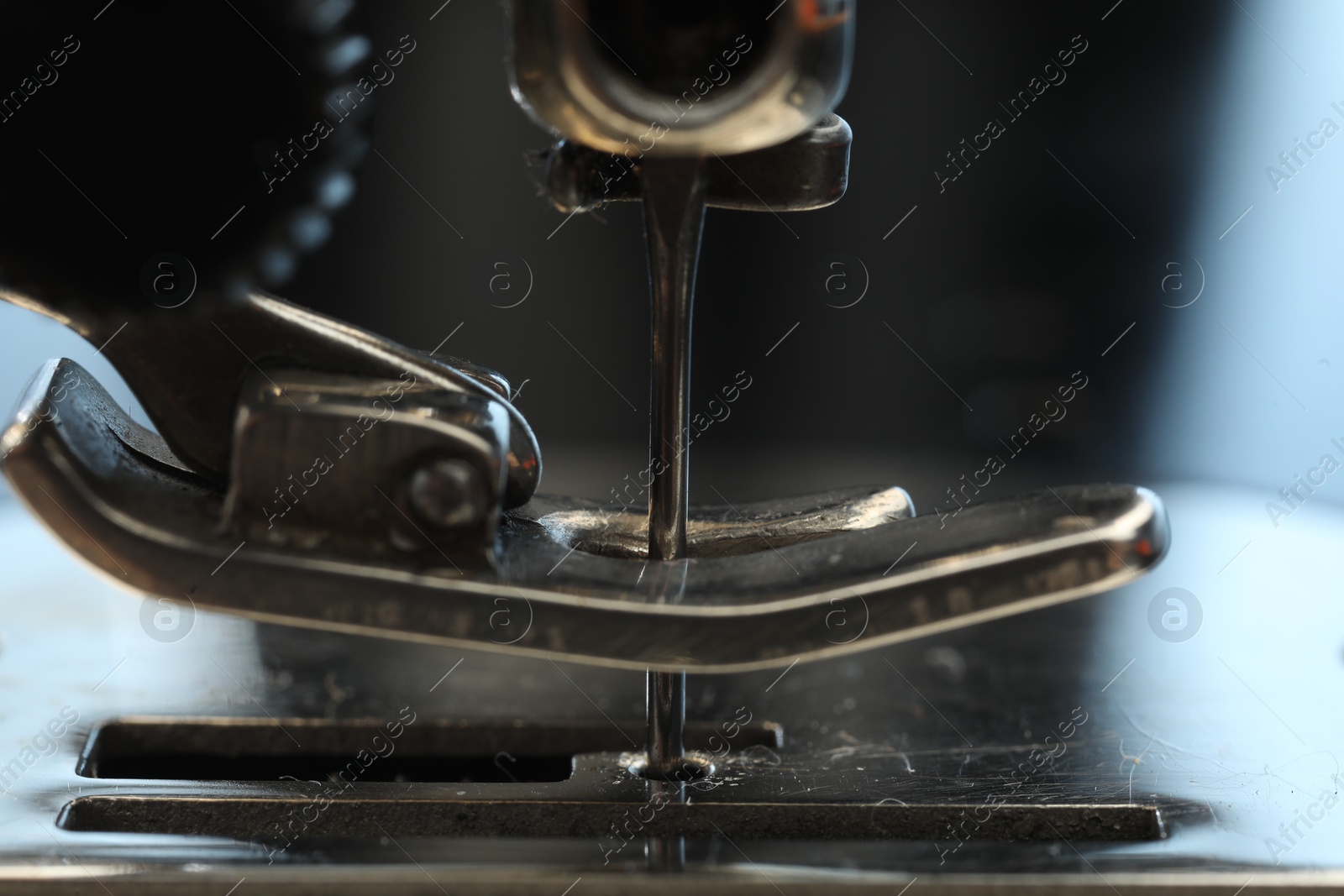 Photo of Sewing machine on color background, macro view