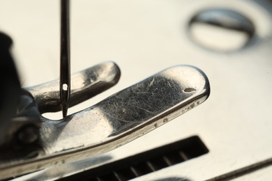 Photo of Macro view of one metal sewing machine