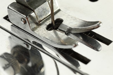 Photo of Macro view of one metal sewing machine