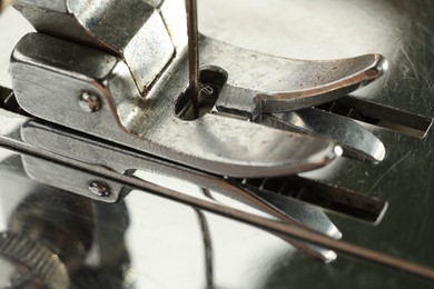 Photo of Macro view of one metal sewing machine