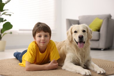 Boy with his cute dog at home