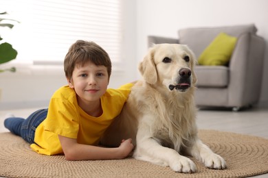 Photo of Boy with his cute dog at home