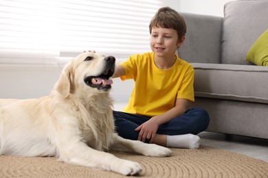 Boy with his cute dog at home