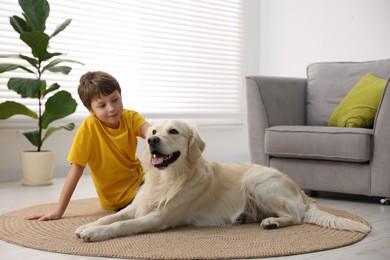 Boy with his cute dog at home