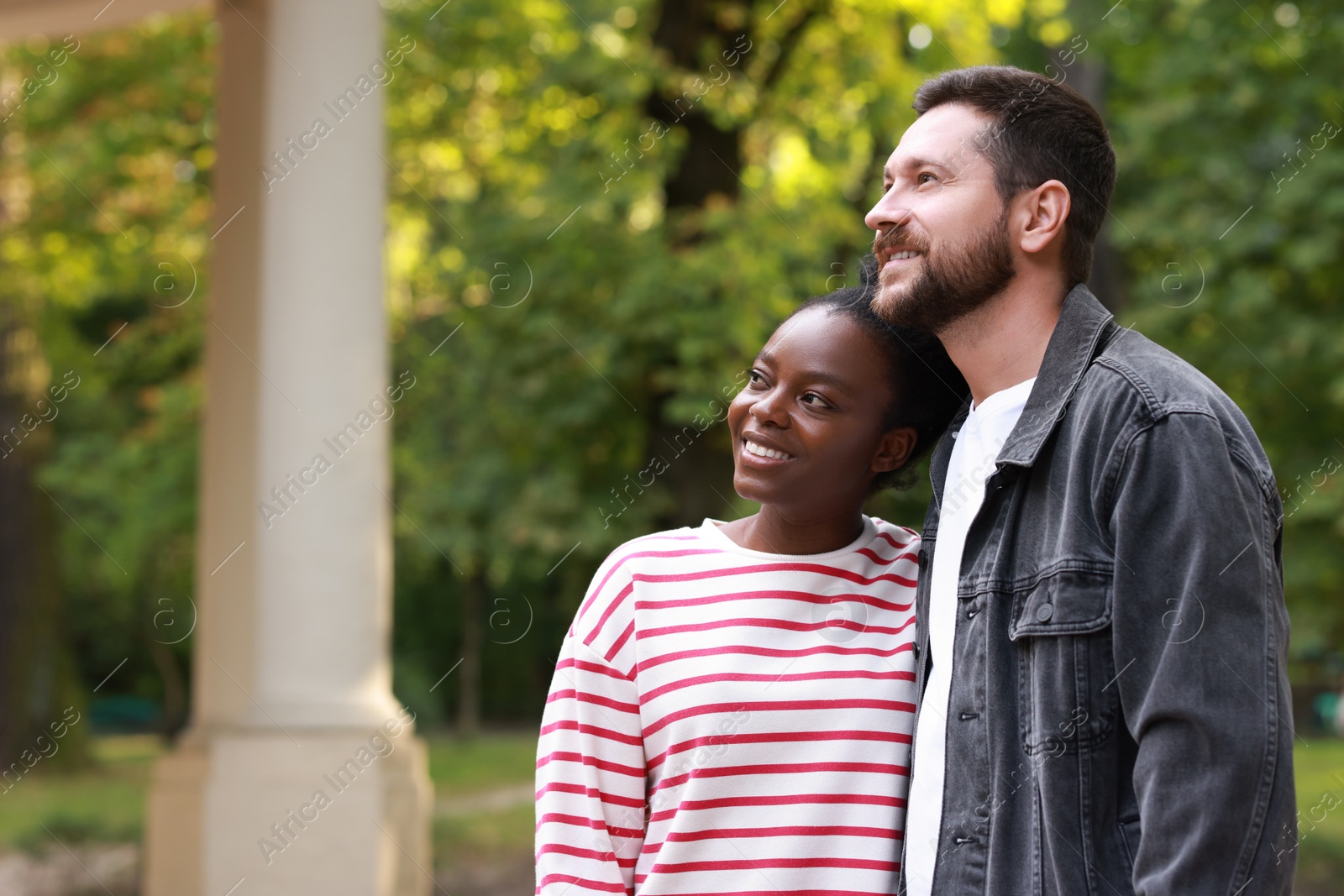 Photo of International relationships. Portrait of lovely couple outdoors, space for text