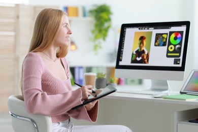 Young designer working with tablet in office