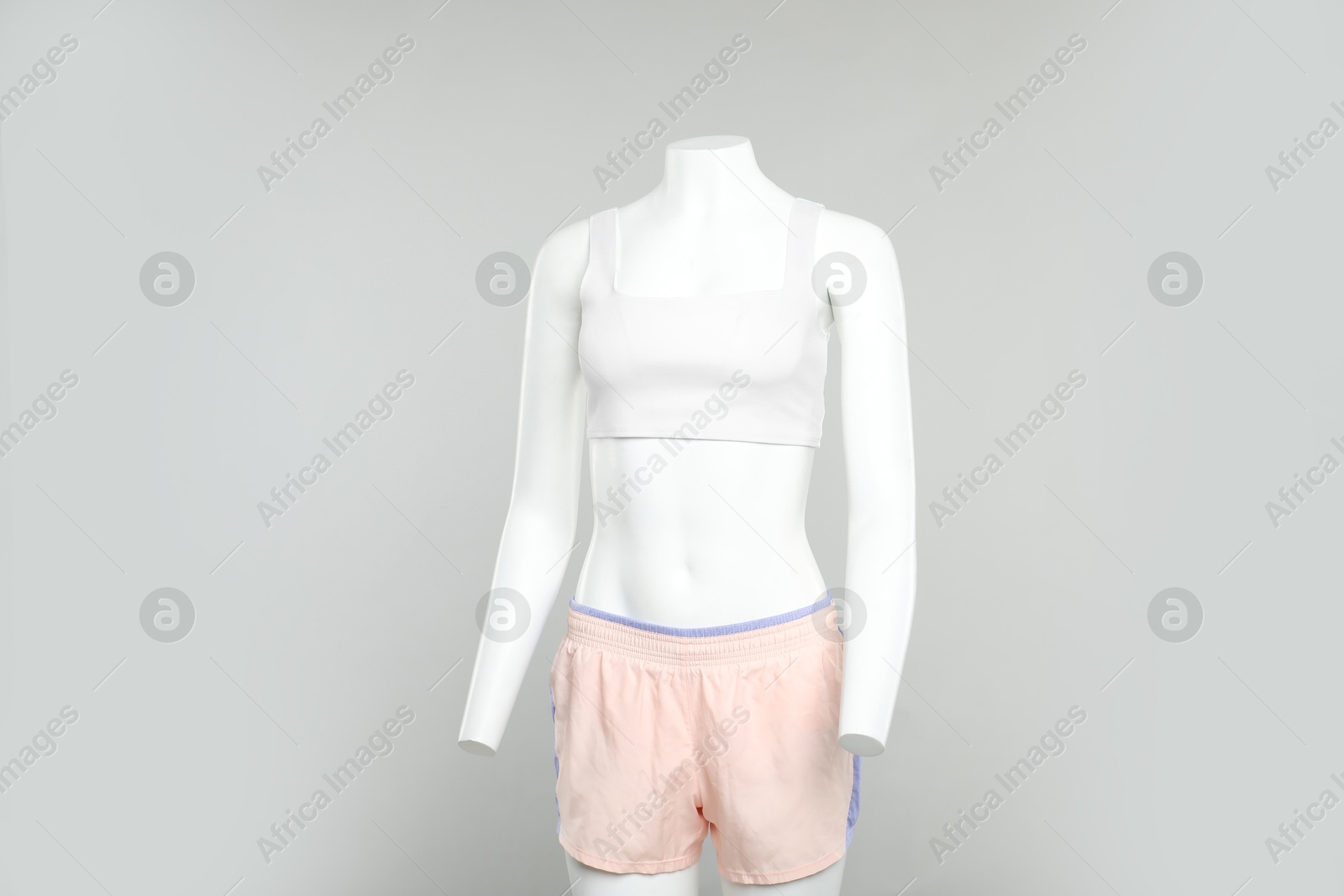 Photo of Female mannequin with stylish sportswear on light background