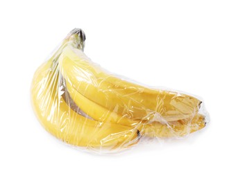 Photo of Fresh bananas with plastic food wrap isolated on white