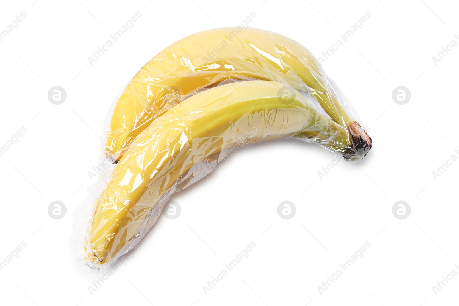 Photo of Fresh bananas with plastic food wrap isolated on white, top view