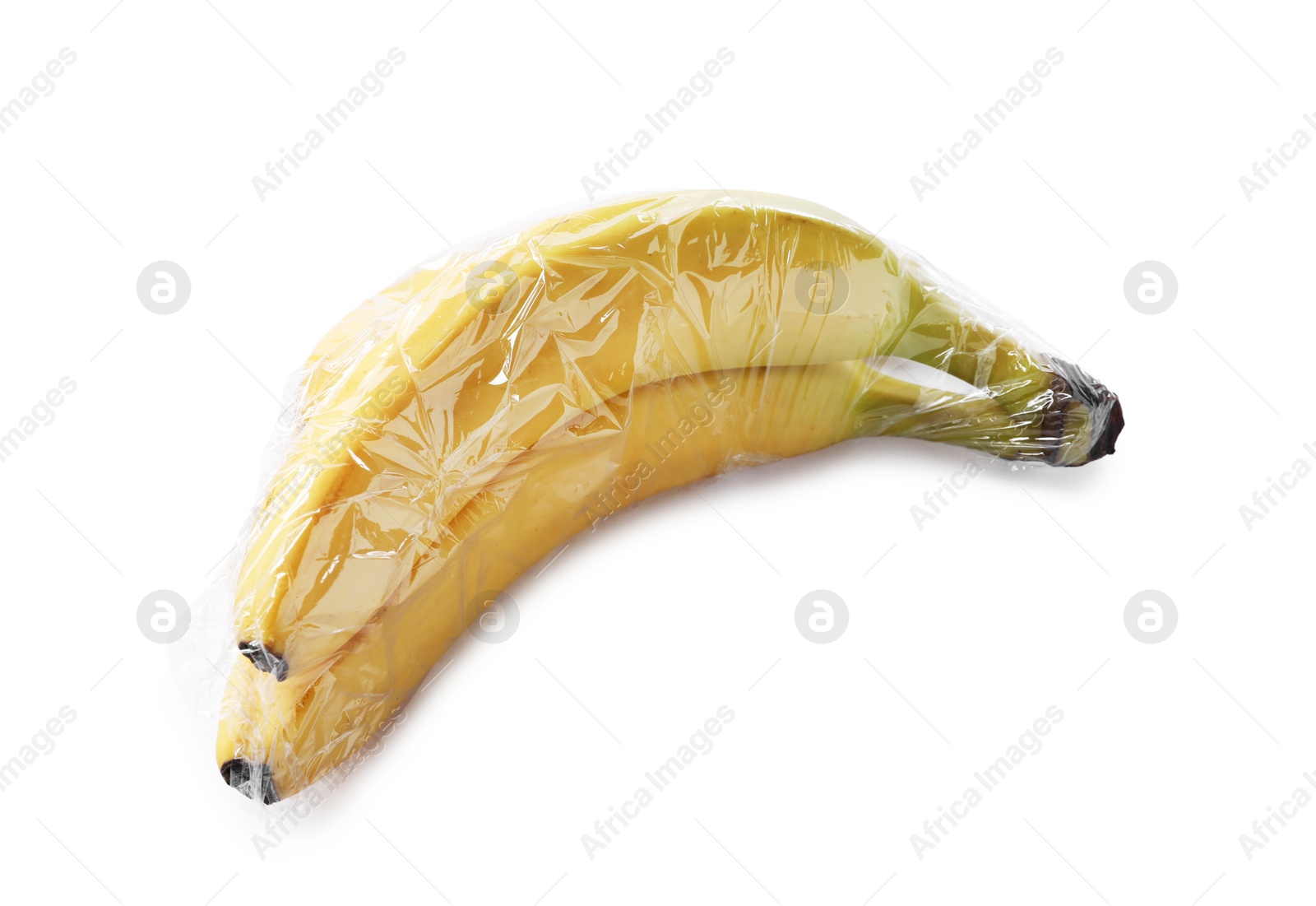 Photo of Fresh bananas with plastic food wrap isolated on white