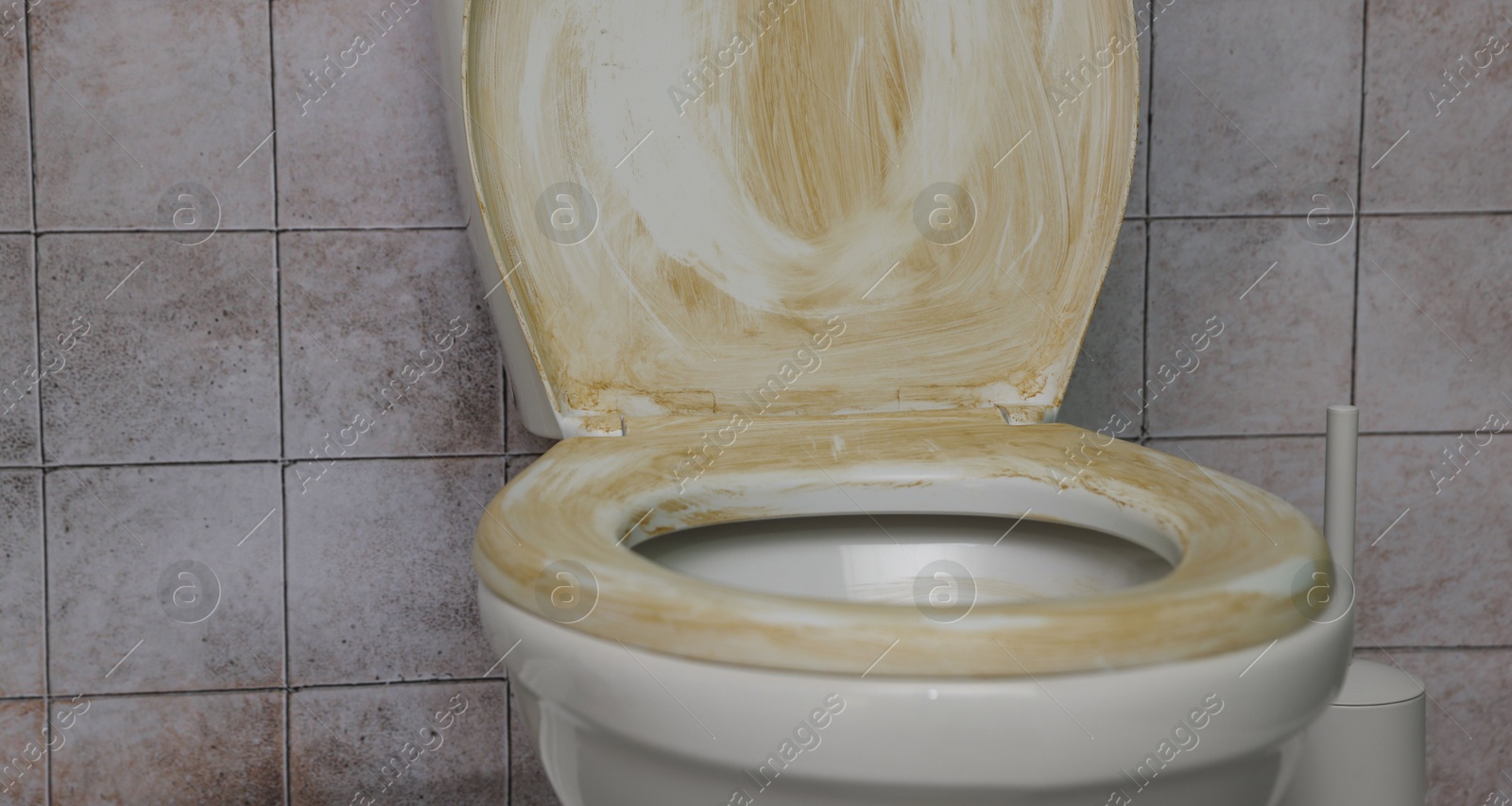 Photo of Toilet with dirty seat in public restroom, closeup